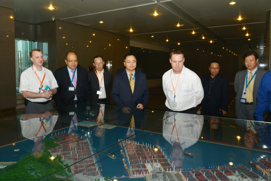The USCG delegation looks at the YICT port model