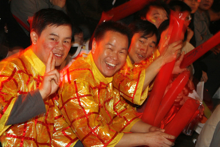 Joyful performers wait for their turn.