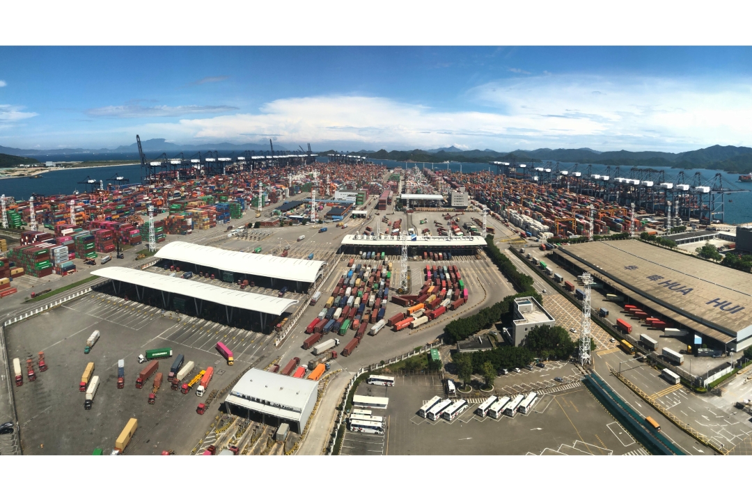 Terminal bustling with vessels in the hot summer